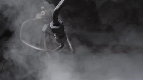 Steam train in the mornign on a train station with smoke Stock Footage 107154436