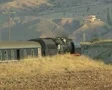 Steam train moving round bend SD Footage