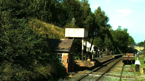 Steam train moving though a train station Stock Footage 857225