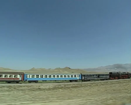 Steam train moving through countryside Stock Footage 8522044