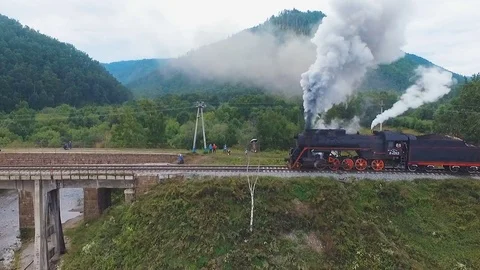 Steam train over bridge summer landscape aerial view Stock Footage 78156023