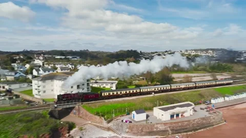 Steam Train over Goodrington Beach from a drone, Paignton, Devon, England Stock Footage 238015932