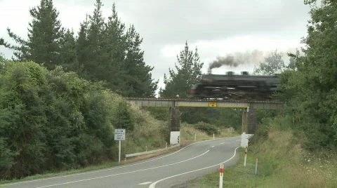 Steam train passes over road Stock-Footage 640540