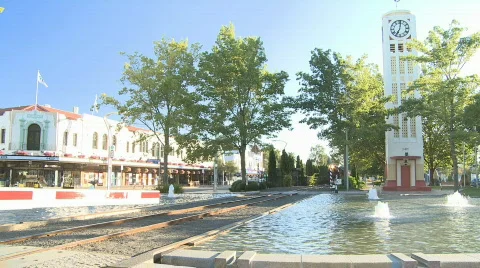 Steam train passes through town centre Stock Footage 640368