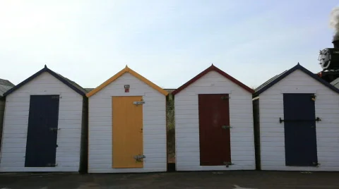 Steam Train passing Beach Huts, Goodrington, Paignton, Devon Stock Footage 874523