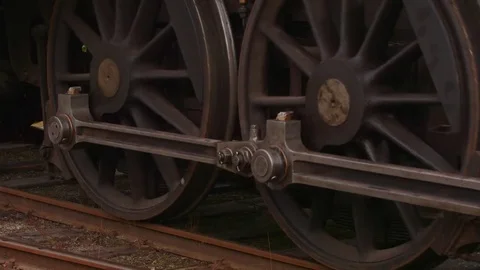 Steam train passing slow speed revers drive wheels details Stock Footage