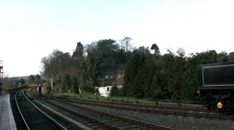 Steam train passing at the station Stock Footage 657782