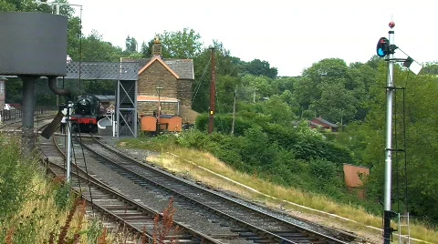 Steam train passing at the station, JVC GY-HM100E Stock Footage 780463