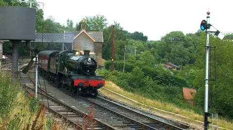 Steam train passing at the station, JVC GY-HM100E Stock Footage 780470