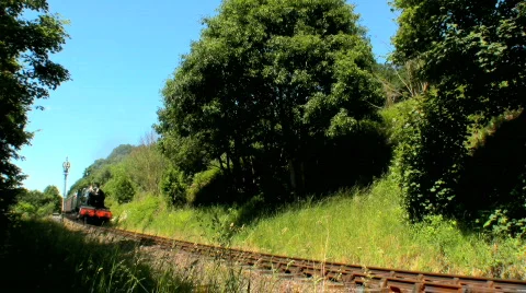 Steam train passing though the countryside Stock Footage 148794