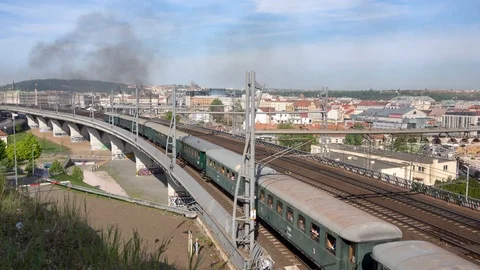 Steam Train passing through Prague, Prague Castle in the background Stock Footage 91365568