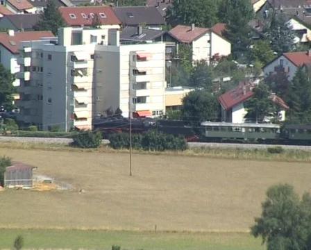 Steam train passing through rural area Stockbeeldmateriaal 312204