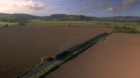 Steam train passing world war two pillbox. Stockbeeldmateriaal 81645996