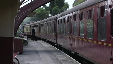 Steam train at platform at Yorkshire station Stock Footage 240415767