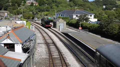 Steam Train pulling in to station in Dartmouth station Devon Stock Footage 29056964