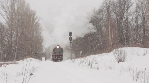 Steam train in Russian winter forest Stock Footage 64278569