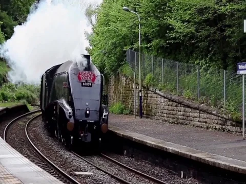 Steam Train Union of South Africa heads through Wetheral, in Northern England. Stock Footage