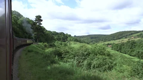 Steam train view from outside window of moving train Stock Footage 240578705