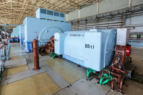Steam turbine generator in turbine hall at nuclear power station Stock Photos