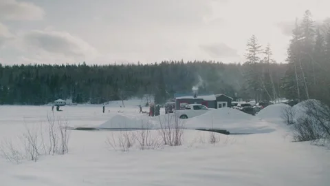 Steam Venting From Tiny Hut On Frozen White Lake Megantic In Quebec. Stock Footage 153444244