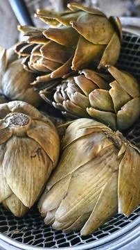 Steamed Artichokes Close-Up, Rustic Kitchen Style, Healthy Cooking Concept Stock Photos