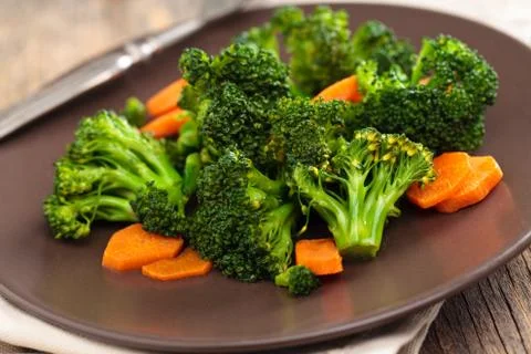 Steamed broccoli on plate. Stock Photos