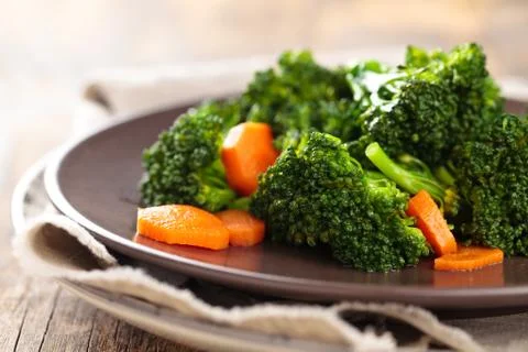 Steamed broccoli on plate. Stock Photos