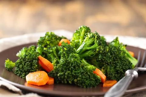 Steamed broccoli on plate. Stock Photos