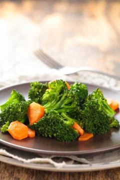 Steamed broccoli on plate. Stock Photos