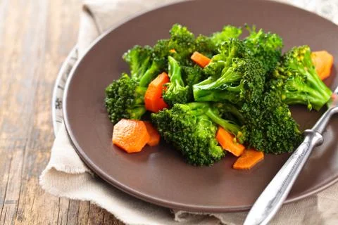 Steamed broccoli on plate. Stock Photos