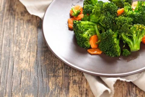 Steamed broccoli on plate. Stock Photos