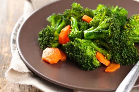 Steamed broccoli on plate. Stock Photos