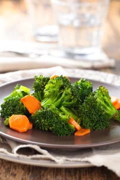 Steamed broccoli on plate. Stock Photos