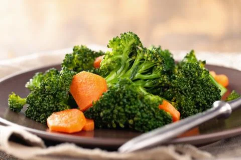 Steamed broccoli on plate. Stock Photos