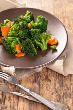 Steamed broccoli on plate. Stock Photos