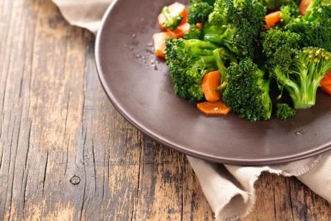 Steamed broccoli on plate. Stock Photos