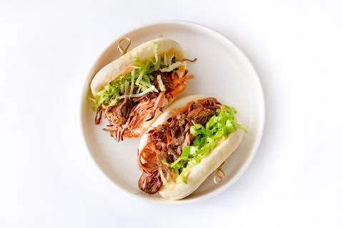 Steamed buns Bao with pulled beef and iceberg lettuce Stock Photos