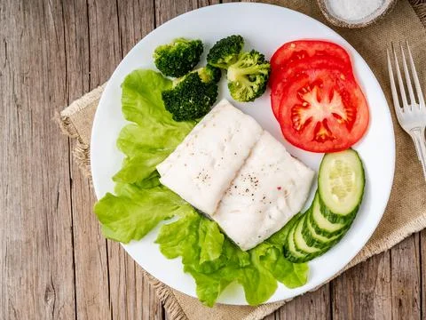 Steamed cod fish. Paleo, keto, fodmap healthy diet with Stock Photos