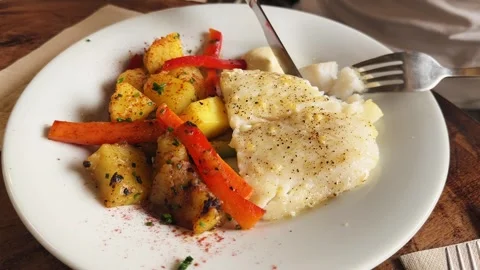 Steamed cod with grilled vegetables and aioli sauce, healthy tasty food. Stock Footage 306162858