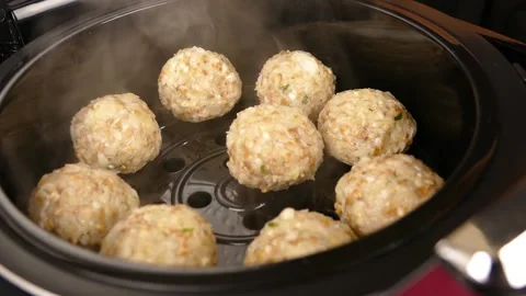 Steamed cutlets in the multicooker Stock Footage 231159374