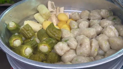 Steamed dim sum and siomay on the in a steamer Stock Footage 310554386