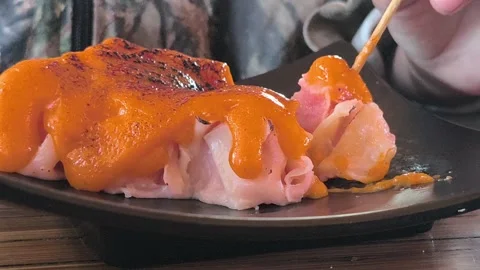 Steamed Dim Sum with Mentai Sauce on a Wooden Table Stock Footage 338378599