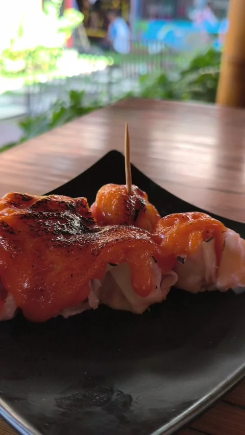 Steamed Dim Sum with Mentai Sauce on a Wooden Table Stock Footage 338378981