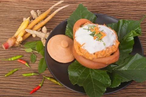 Steamed fish with curry paste in clay pot Stock Photos