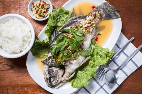Steamed fish with lemon Stock Photos