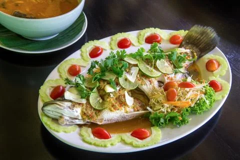 Steamed fish with lemon. Stock Photos
