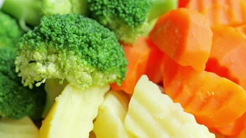 Steamed Mixed Broccoli Carrot Cauliflower Vegetable Closeup with Fresh Crisp Stock Footage 346328107