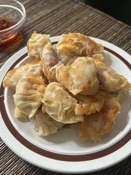 Steamed or fried Korean mandu dumplings filled with a savory mix of meat an.. Stock Photos