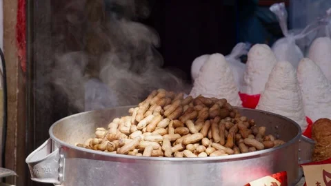 Steamed Peanuts in Metal Pot at Local Market — Traditional Snack Scene 動画素材 312585053