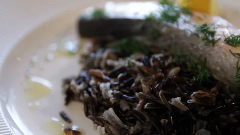 Steamed red fish, served with black rice and lemon. high protein foods. the Stock Footage 114700872